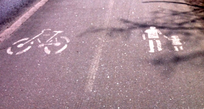 A police outline of a flattened mother & child and the bicycle they suspect did it